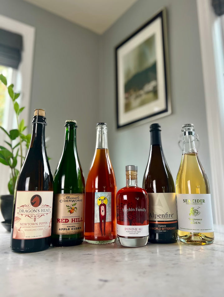 6 bottles of cider: Dragon's Head, Albemarle Cider, South Hill Cider, Haykin Pommeau, Alpenfire Cider, and Sea Cider N/A Cider