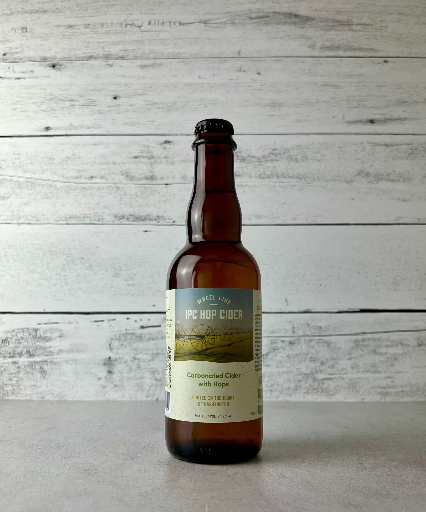 375 mL bottle of Wheel Line IPC Hop Cider - Carbonated Cider with Hops - Rooted in the Heart of Washington