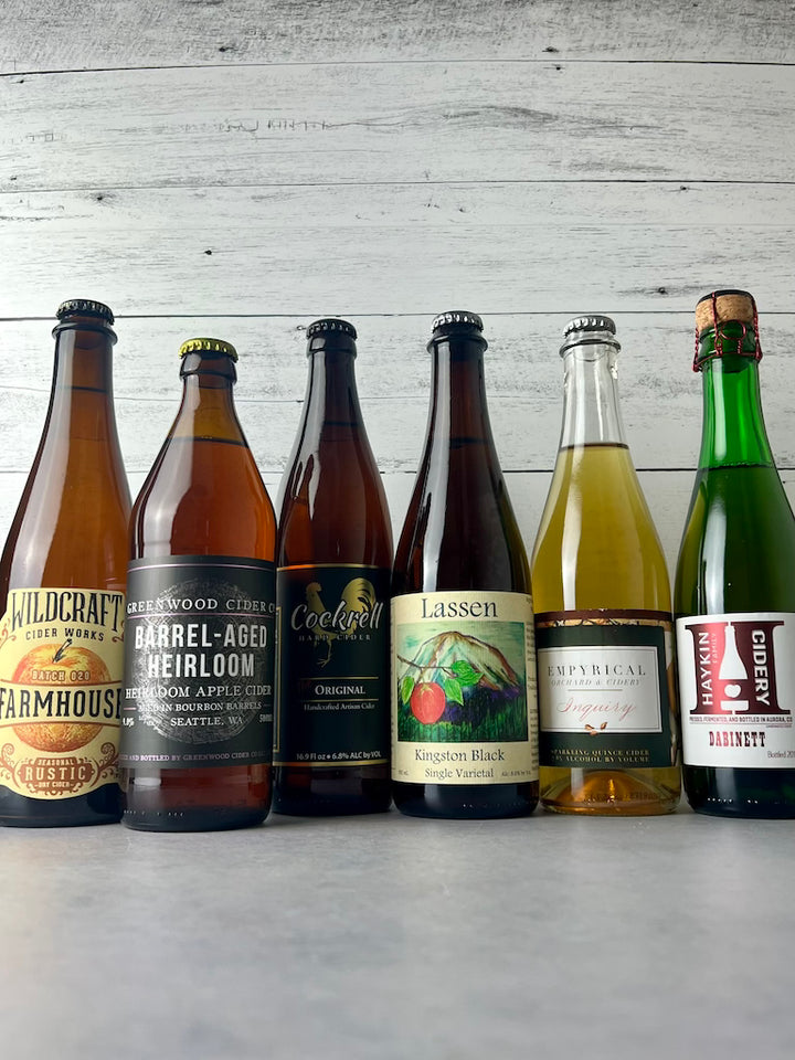 6 bottles of 500 mL snd 375 mL ciders, including Wildcraft Cider Works, Greenwood Cider, Cockrell Cider, Lassen Cider, Empyrical Cider, and Haykin Cidery